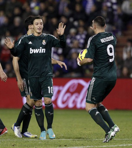 Real Madrid's Mesut Ozil (L) celebrates scoring a goal against Real Valladolid, on December 8, 2012 Real Madrid's Mesut Ozil (L) celebrates scoring a goal against Real Valladolid, on December 8, 2012