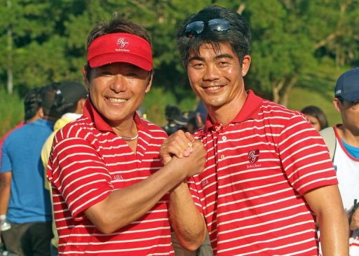Asia Team Captain Naomichi Joe Ozaki of Japan (left) and Vice Captain Lian Wen Chong celebrate Asia Team Captain Naomichi Joe Ozaki of Japan (left) and Vice Captain Lian Wen Chong celebrate