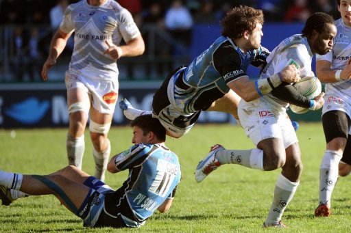 Castres winger Marcel Garvey (R) collapses with Glasgow players Castres winger Marcel Garvey (R) collapses with Glasgow players