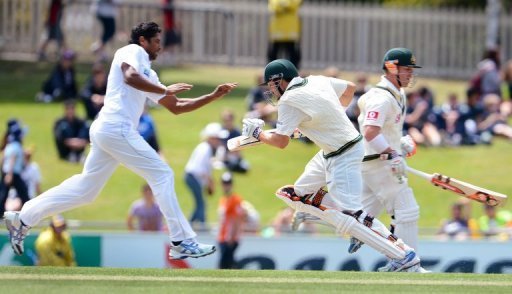 Chanaka Welegedara (L) reacts as Ed Cowan (C) and David Warner take more runs at the Hobart Test on December 17, 2012 Chanaka Welegedara (L) reacts as Ed Cowan (C) and David Warner take more runs at the Hobart Test on December 17, 2012