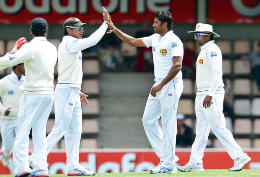 Sri Lanka's Chanaka Welegedara (2/R) is congratulated by teammates after taking a wicket on December 17, 2012 Sri Lanka's Chanaka Welegedara (2/R) is congratulated by teammates after taking a wicket on December 17, 2012