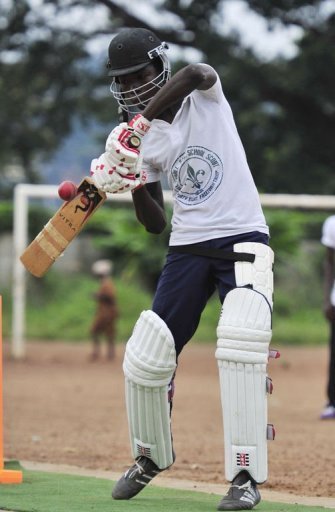 A man plays cricket at Kingtom Oval in Freetown, Sierra Leone's only cricket ground, on November 15, 2012 A man plays cricket at Kingtom Oval in Freetown, Sierra Leone's only cricket ground, on November 15, 2012