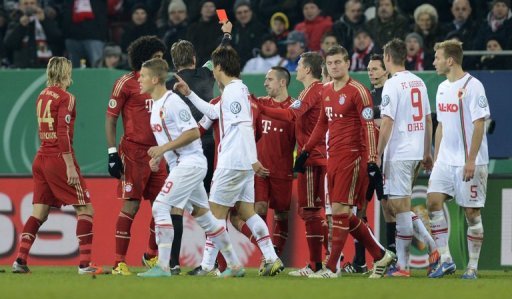 The referee shows the red card to Bayern Munich's Franck Ribery during a match against FC Augsburg on December 18, 2012 The referee shows the red card to Bayern Munich's Franck Ribery during a match against FC Augsburg on December 18, 2012