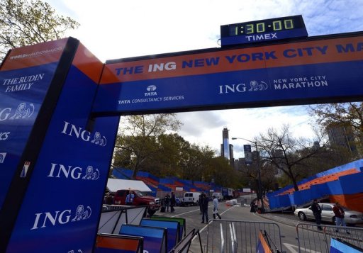 Workers construct the finish line for the 43rd New York City Marathon on November 2, 2012 Workers construct the finish line for the 43rd New York City Marathon on November 2, 2012