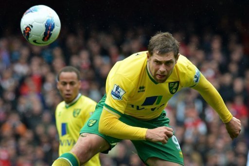 Grant Holt nods a header for Norwich against Arsenal at The Emirates Stadium in north London on May 5, 2012 Grant Holt nods a header for Norwich against Arsenal at The Emirates Stadium in north London on May 5, 2012