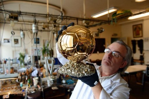Artisan Michel Garault works on the Ballon d'Or 2012 at the Mellerio jewelery workshops in Paris on December 6, 2012 Artisan Michel Garault works on the Ballon d'Or 2012 at the Mellerio jewelery workshops in Paris on December 6, 2012