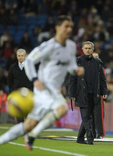 Real Madrid's coach Jose Mourinho (R), pictured during their match against Espanyol, in Madrid, on December 16, 2012 Real Madrid's coach Jose Mourinho (R), pictured during their match against Espanyol, in Madrid, on December 16, 2012