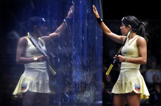 Nicol David of Malaysia (R) is reflected in the glass during a tournament on August 19, 2012 in Canberra Nicol David of Malaysia (R) is reflected in the glass during a tournament on August 19, 2012 in Canberra