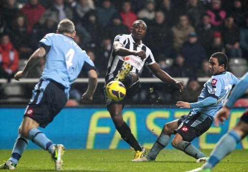Newcastle's striker Shola Ameobi (2nd L) scores in Newcastle, England on December 22, 2012 Newcastle's striker Shola Ameobi (2nd L) scores in Newcastle, England on December 22, 2012