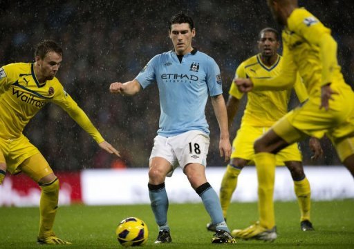 Manchester City's midfielder Gareth Barry fights for the ball in Manchester on December 22, 2012 Manchester City's midfielder Gareth Barry fights for the ball in Manchester on December 22, 2012