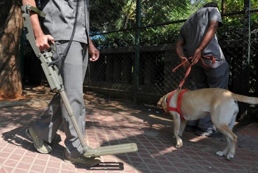 Indian bomb squad officials carry out a routine check outside the Chinnaswamy stadium in Bangalore on December 24, 2012 Indian bomb squad officials carry out a routine check outside the Chinnaswamy stadium in Bangalore on December 24, 2012