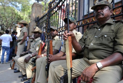 Armed Indian police on guard at the main gate of the M. Chinnaswamy Stadium in Bangalore on December 25, 2012 Armed Indian police on guard at the main gate of the M. Chinnaswamy Stadium in Bangalore on December 25, 2012