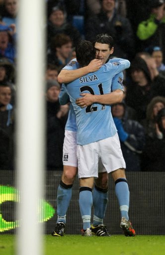 City midfielder Gareth Barry celebrates with David Silva after scoring his injury-time winner on December 22, 2012 City midfielder Gareth Barry celebrates with David Silva after scoring his injury-time winner on December 22, 2012