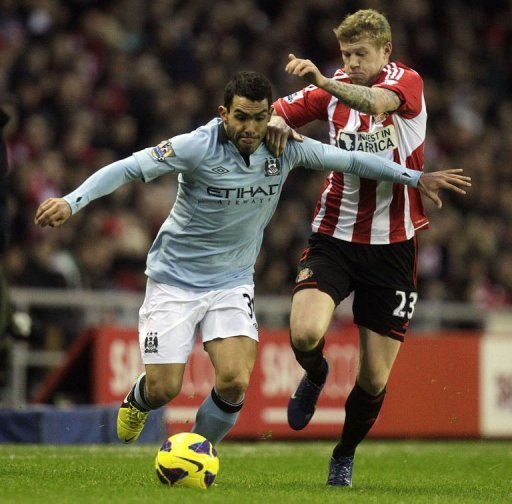 Sunderland's James McClean (R) battles with Carlos Tevez on December 26, 2012 Sunderland's James McClean (R) battles with Carlos Tevez on December 26, 2012