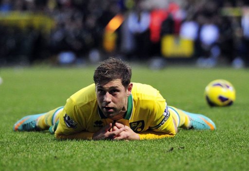 Norwich City's Grant Holt reacts after being tackled by Chelsea's David Luiz in Norwich on December 26, 2012 Norwich City's Grant Holt reacts after being tackled by Chelsea's David Luiz in Norwich on December 26, 2012