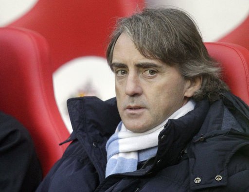 Manchester City manager Roberto Mancini takes his seat at The Stadium of Light in Sunderland on December 26, 2012 Manchester City manager Roberto Mancini takes his seat at The Stadium of Light in Sunderland on December 26, 2012