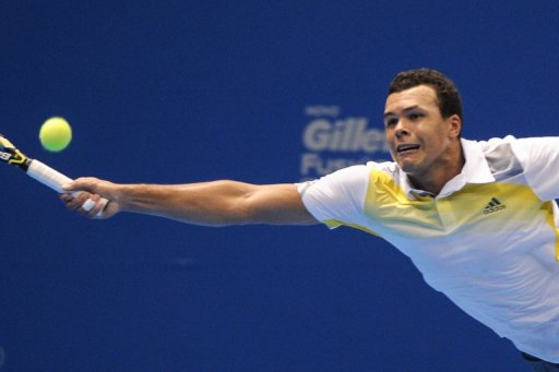 Jo-Wilfried Tsonga returns a shot against Roger Federer during an exhibition match in Sao Paulo on December 8, 2012 Jo-Wilfried Tsonga returns a shot against Roger Federer during an exhibition match in Sao Paulo on December 8, 2012