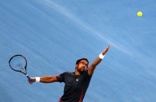 Serbia's Janko Tipsarevic serves to Britain's Andy Murray in the Emirati capital Abu Dhabi on December 27, 2012 Serbia's Janko Tipsarevic serves to Britain's Andy Murray in the Emirati capital Abu Dhabi on December 27, 2012