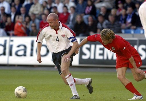 Henning Berg (L), pictured during his playing days in a friendly against Wales in Oslo 27 May, 2004 Henning Berg (L), pictured during his playing days in a friendly against Wales in Oslo 27 May, 2004