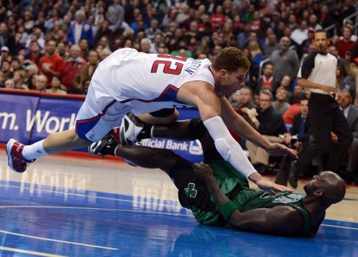 Blake Griffin of the Clippers knocks over Kevin Garnett of the at Staples Center on December 27, 2012 Blake Griffin of the Clippers knocks over Kevin Garnett of the at Staples Center on December 27, 2012
