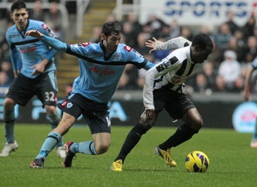 Newcastle midfielder Vurnon Anita (R) turns away from QPR midfielder Esteban Granero on December 22, 2012 Newcastle midfielder Vurnon Anita (R) turns away from QPR midfielder Esteban Granero on December 22, 2012