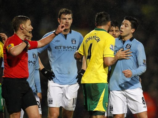 Manchester City's Samir Nasri (R) is sent off by referee Mike Jones (L) at Carrow Road, December 29, 2012 Manchester City's Samir Nasri (R) is sent off by referee Mike Jones (L) at Carrow Road, December 29, 2012