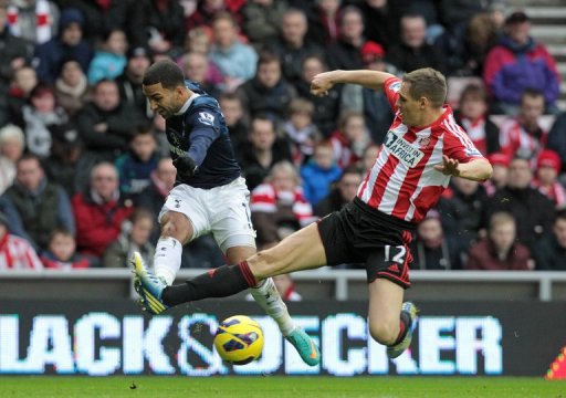 Sunderland's Matthew Kilgallon (R) makes a lunge at Tottenham Hotspur's Aaron Lennon December 29, 2012 Sunderland's Matthew Kilgallon (R) makes a lunge at Tottenham Hotspur's Aaron Lennon December 29, 2012