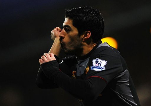 Liverpool's Luis Suarez celebrates after scoring at Loftus Road on December 30, 2012 Liverpool's Luis Suarez celebrates after scoring at Loftus Road on December 30, 2012
