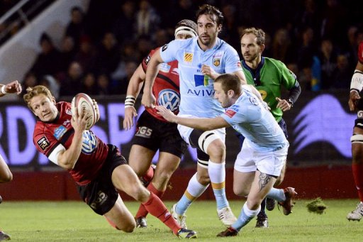 Perpignan's David Mele (R) tries to stop RC Toulon's Jonny Wilkinson (L) on December 30, 2012, at the Mayol stadium Perpignan's David Mele (R) tries to stop RC Toulon's Jonny Wilkinson (L) on December 30, 2012, at the Mayol stadium