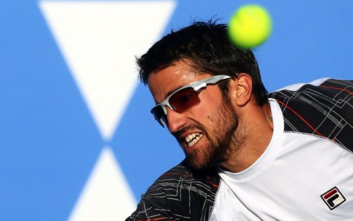 Janko Tipsarevic returns the ball to Spain's David Ferrer in Abu Dhabi on December 29, 2012 Janko Tipsarevic returns the ball to Spain's David Ferrer in Abu Dhabi on December 29, 2012