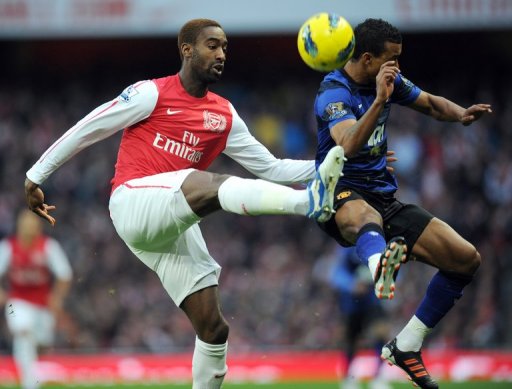 Arsenal's Johan Djourou (left) and Manchester United's Patrice Evra , January 22, 2012 at the Emirates Stadium in London Arsenal's Johan Djourou (left) and Manchester United's Patrice Evra , January 22, 2012 at the Emirates Stadium in London
