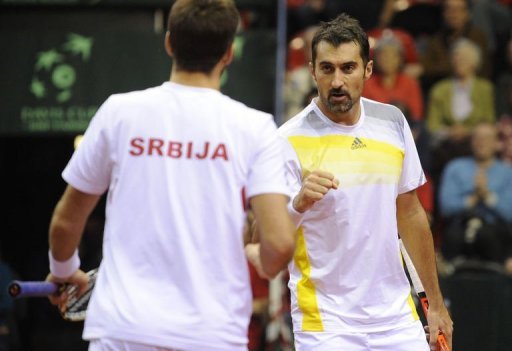 Serbia's Viktor Troicki (L) and Nenad Zimonjic play doubles against Belgium on February 2, 2013 in Charleroi Serbia's Viktor Troicki (L) and Nenad Zimonjic play doubles against Belgium on February 2, 2013 in Charleroi