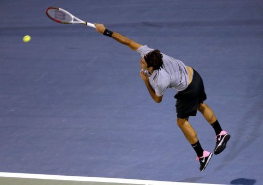 Roger Federer serves to Malek Jaziri in Dubai on February 25, 2013 Roger Federer serves to Malek Jaziri in Dubai on February 25, 2013