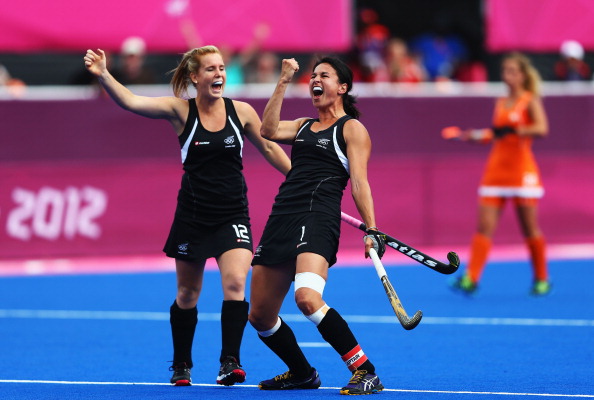 LONDON, ENGLAND - AUGUST 08: Kayla Sharland of New Zealand celebrates scoring the first goal for New Zealand with her team-mate Ella Gunson during the Women's Hockey semi-final match between New Zealand and the Netherlands on Day 12 of the London 2012 Olympic Games at Riverbank Arena Hockey Centre on August 8, 2012 in London, England. (Photo by Paul Gilham/Getty Images)
