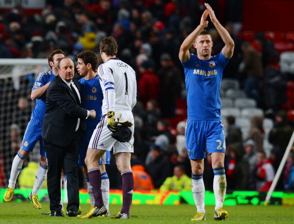 Chelsea's Spanish manager Rafael Benitez (L) shakes hands with his players after their English FA Cup quarter-final football match between Manchester United and Chelsea at Old Trafford, Manchester, northwest England on March 10, 2013. The match ended 2-2.