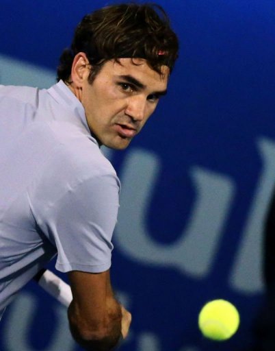 Roger Federer returns the ball at the Dubai Open on February 28, 2013 Roger Federer returns the ball at the Dubai Open on February 28, 2013