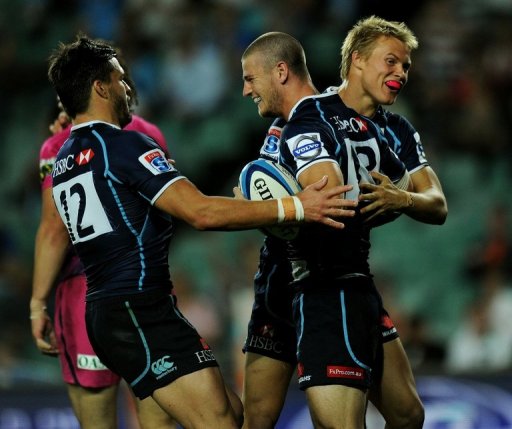 Waratahs' Robert Horne (C) is congratulated by teammates after scoring a try against Bulls, in Sydney, on May 11, 2012 Waratahs' Robert Horne (C) is congratulated by teammates after scoring a try against Bulls, in Sydney, on May 11, 2012