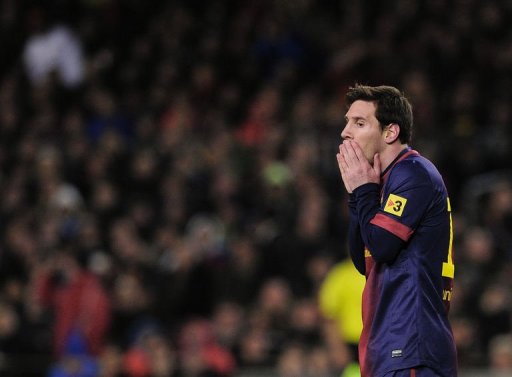 Barcelona's forward Lionel Messi reacts during their Spanish Cup match against Real Madrid on February 26, 2013 Barcelona's forward Lionel Messi reacts during their Spanish Cup match against Real Madrid on February 26, 2013