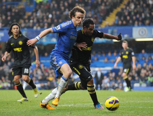 Chelsea's David Luiz (L) tries to run down Wigan Athletic's Jean Beausejour at Stamford Bridge on February 9, 2013 Chelsea's David Luiz (L) tries to run down Wigan Athletic's Jean Beausejour at Stamford Bridge on February 9, 2013