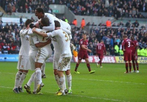 Swansea City's players celebrate Luke Moore's goal at Liberty Stadium in Swansea, south Wales, on March 2, 2013 Swansea City's players celebrate Luke Moore's goal at Liberty Stadium in Swansea, south Wales, on March 2, 2013