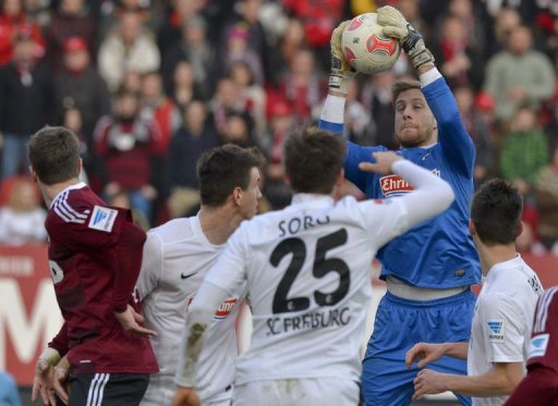 Freiburg's goalkeeper Oliver Baumann (2nd R) saves the ball in Nuremberg, southern Germany on March 2, 2013 Freiburg's goalkeeper Oliver Baumann (2nd R) saves the ball in Nuremberg, southern Germany on March 2, 2013