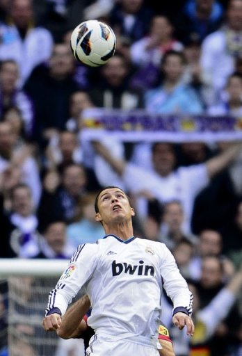 Real Madrid's forward Cristiano Ronaldo eyes the ball at the Santiago Bernabeu stadium in Madrid on March 2, 2013 Real Madrid's forward Cristiano Ronaldo eyes the ball at the Santiago Bernabeu stadium in Madrid on March 2, 2013