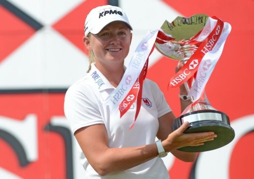 Stacy Lewis holds the trophy after winning the final round of the HSBC Women's Champions in Singapore on March 3, 2013 Stacy Lewis holds the trophy after winning the final round of the HSBC Women's Champions in Singapore on March 3, 2013