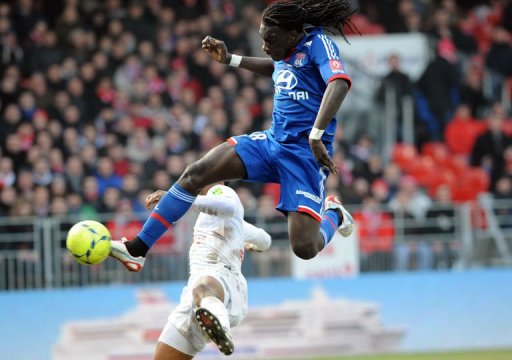 Lyon's Bafetimbi Gomis (R) vies with Brest's Tripy Makonda at the Francis Le Ble stadium on March 3, 2013 in Brest Lyon's Bafetimbi Gomis (R) vies with Brest's Tripy Makonda at the Francis Le Ble stadium on March 3, 2013 in Brest