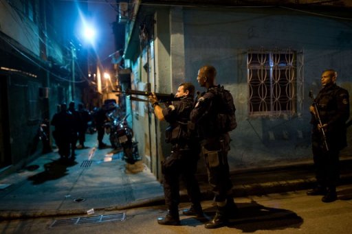 Brazilian BOPE police elite unit personnel patrol in Rio de Janeiro, Brazil, on March 3, 2013 Brazilian BOPE police elite unit personnel patrol in Rio de Janeiro, Brazil, on March 3, 2013