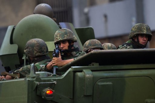 Brazilian marines' APCs leave the Caju shantytown in Rio de Janeiro, Brazil, on March 3, 2013 Brazilian marines' APCs leave the Caju shantytown in Rio de Janeiro, Brazil, on March 3, 2013