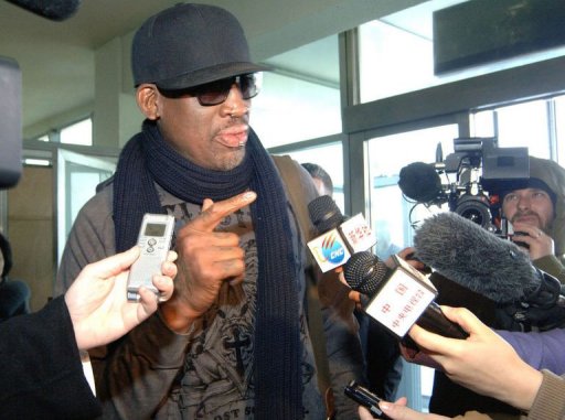 This photo taken on March 1, 2013 shows Dennis Rodman (C) being interviewed at Pyongyang Airport This photo taken on March 1, 2013 shows Dennis Rodman (C) being interviewed at Pyongyang Airport