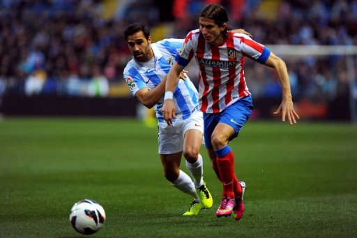 Malaga's Jesus Gamez (L) vies with Atletico Madrid's Filipe Luis on March 3, 2013 at the Rosaleda stadium in Malaga Malaga's Jesus Gamez (L) vies with Atletico Madrid's Filipe Luis on March 3, 2013 at the Rosaleda stadium in Malaga