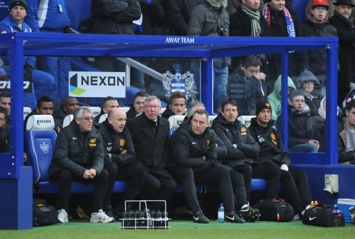 Manchester United's Alex Ferguson (3rd L) watches a match against Queens Park Rangers in London on February 23, 2013 Manchester United's Alex Ferguson (3rd L) watches a match against Queens Park Rangers in London on February 23, 2013