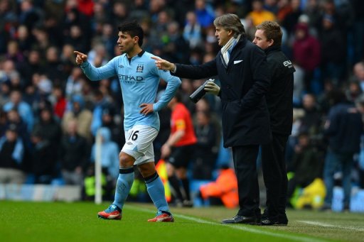 Manchester City's Roberto Mancini (R) talks to Sergio Aguero during their match against Chelsea on February 24, 2013 Manchester City's Roberto Mancini (R) talks to Sergio Aguero during their match against Chelsea on February 24, 2013